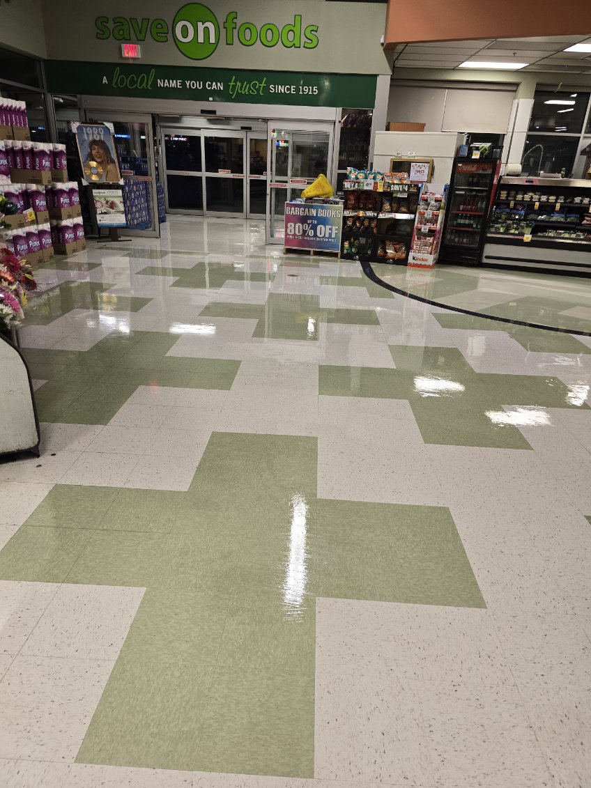 Polished supermarket aisle maintained by Ameche Cleaning Service